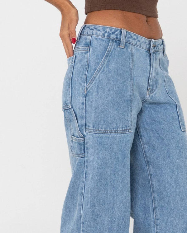 Close-up of Rusty Billie Low Rise Carpenter Pant highlighting stitching and fit.