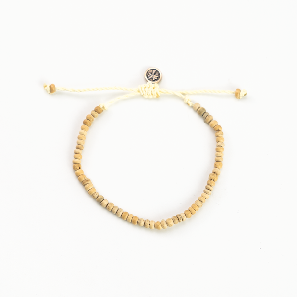 Coconut wood bead bracelet with adjustable cord and button clasp.
