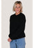 Sisstrevolution Barra Crew Sweater in black, worn by a model with jeans.