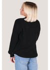 Back view of Sisstrevolution Barra Crew Sweater in black, styled casually.