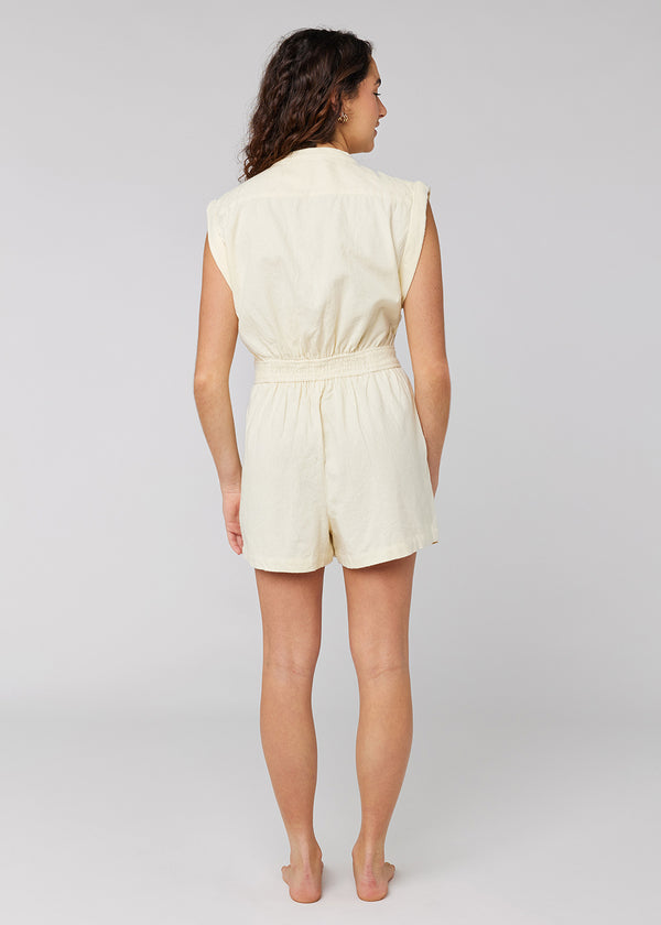 Sisstrevolution In My Sol Romper in white sand, back view with elastic waistband.