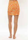 Sisstrevolution Sunshine Swim Knit Skirt in coral with vibrant swirl pattern, back view.