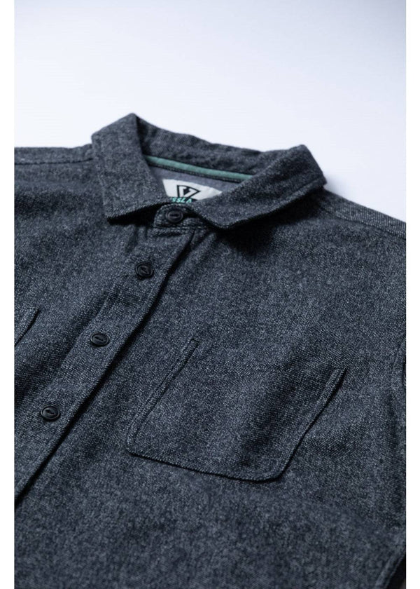 Close-up of Vissla Shaper Eco Flannel chest pockets and collar in black.