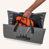 C-Monsta Changing Mat in gray with durable handles, holding orange gear.