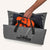 C-Monsta Changing Mat in gray with durable handles, holding orange gear.