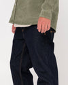 Detailed side view of Rusty Steven Straight Fit Jean in dark denim fabric.