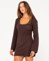 Side angle of Rusty Leo long sleeve knit mini dress in brown with a fitted silhouette.