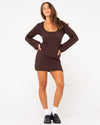 Full-body view of Rusty Leo long sleeve knit mini dress styled with loafers and socks.