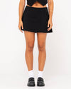 Front view of Rusty Sicily Mid Rise Mini Skirt in black.