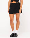 Side angle of Rusty Sicily Mid Rise Mini Skirt in black.
