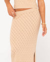 Close-up of Rusty Leo Maxi Knit Skirt showcasing textured knit design and waistband.