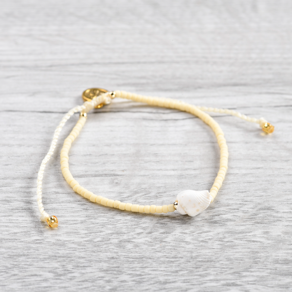 Pineapple Island Shell Bracelet SH-042 with beige beads and shell charm.
