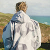 White Water Adult Soft Shell Robe in Arctic Camo, outdoor back view near coastline.