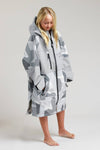 White Water Kids Soft Shell Robe in Arctic Camo, side view on girl.