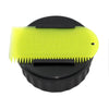 Black Sexwax wax container with yellow comb for surfboard waxing.