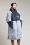 White Water Adult Hard Shell Robe in grey with hood, modeled by a man.