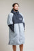 White Water Adult Hard Shell Robe in grey with hood, modeled by a man.