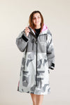 White Water adult hard shell robe in Arctic camo with pink lining, zipped up.