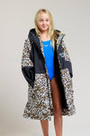 White Water kids leopard print robe with open front, revealing swimsuit.