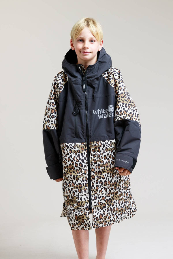 White Water kids hard shell robe in leopard print, modeled by a child.