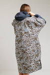Back view of leopard print White Water robe with black hood and ventilation detail.
