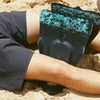 Vissla DaFin x Fins resting on sandy beach, showcasing unique design.