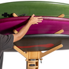 Eco-friendly bamboo surfboard rack holding three boards securely.