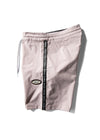 Side view of Vissla Trip Out 17.5" boardshort in mauve with logo and stripe detail.