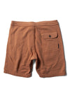 Vissla Solid Sets Eco 18.5" Sofa Surfer shorts in guava, back view.