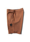 Vissla Solid Sets Eco 18.5" Sofa Surfer shorts in guava, folded view.