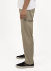 Vissla No See Ums Eco Elastic Pant in khaki, worn side view.