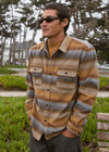 Man wearing Vissla Eco-Zy Polar Flannel, khaki, outdoors with casual style.