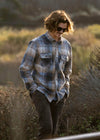 Man wearing Vissla Eco-Zy Polar Flannel shirt outdoors.