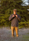 Man wearing Vissla Shaper Eco Flannel, black, outdoors in nature.