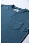 Close-up of Vissla Solid Sets Pkt Tee pocket and neckline in sea water color.