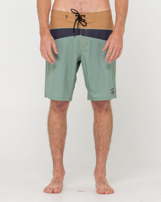 Rusty Chop Suey Boardshort with green, tan, and navy color blocks, front view.