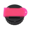 Black Sexwax wax container with pink comb for surfboard care.