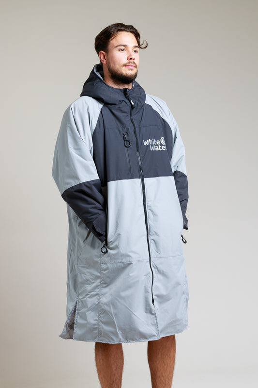 White Water Adult Hard Shell Robe in grey with hood, modeled by a man.