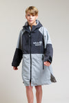 Grey White Water kids poncho robe with hood, worn by a boy.