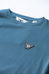 Close-up of Vissla Solid Sets Eco Crew sweatshirt logo detail.