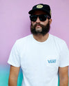 Man posing in I-Sea V-Lander black rubber sunglasses with smoke polarized lenses against a colorful background.