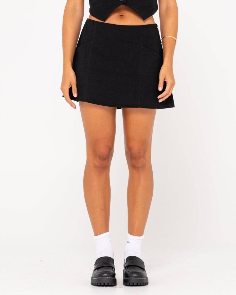 Front view of Rusty Sicily Mid Rise Mini Skirt in black.