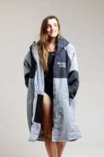 White Water Adult Hard Shell Robe in grey, open front, modeled by a woman.