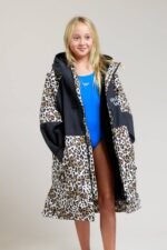 White Water kids leopard print robe with open front, revealing swimsuit.