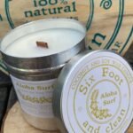 Six foot & clean Aloha Surf natural coconut and soy wax candle with lid.